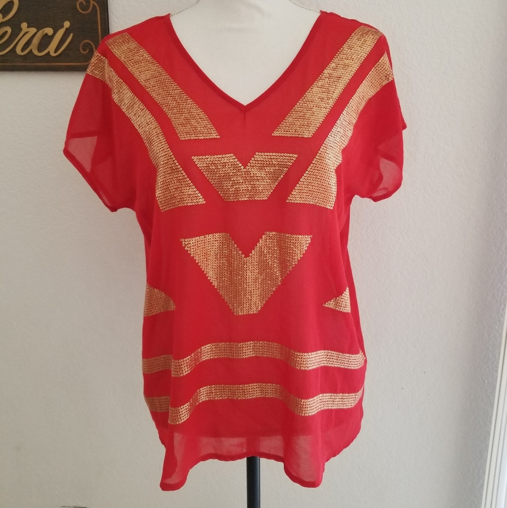Red blouse with gold sequins